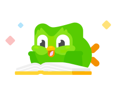 image of Duo the owl lying on the floor happily reading a book. He looks excited and little colorful  sparkles are circling him