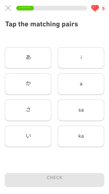 Screenshot of a match exercise with two columns of four rows. The prompt says 'Tap the matching pairs'. The left column has four different Japanese characters and the right column has four different sounds written in the Latin alphabet: i, a, sa, and ka.