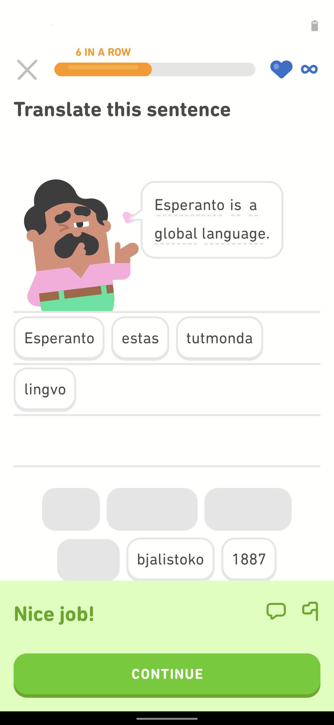Screenshot of an exercise from Duolingo's Esperanto course. The Duolingo character Oscar says in English "Esperanto is a global language." and the Esperanto translation is spelled out below in word tiles.