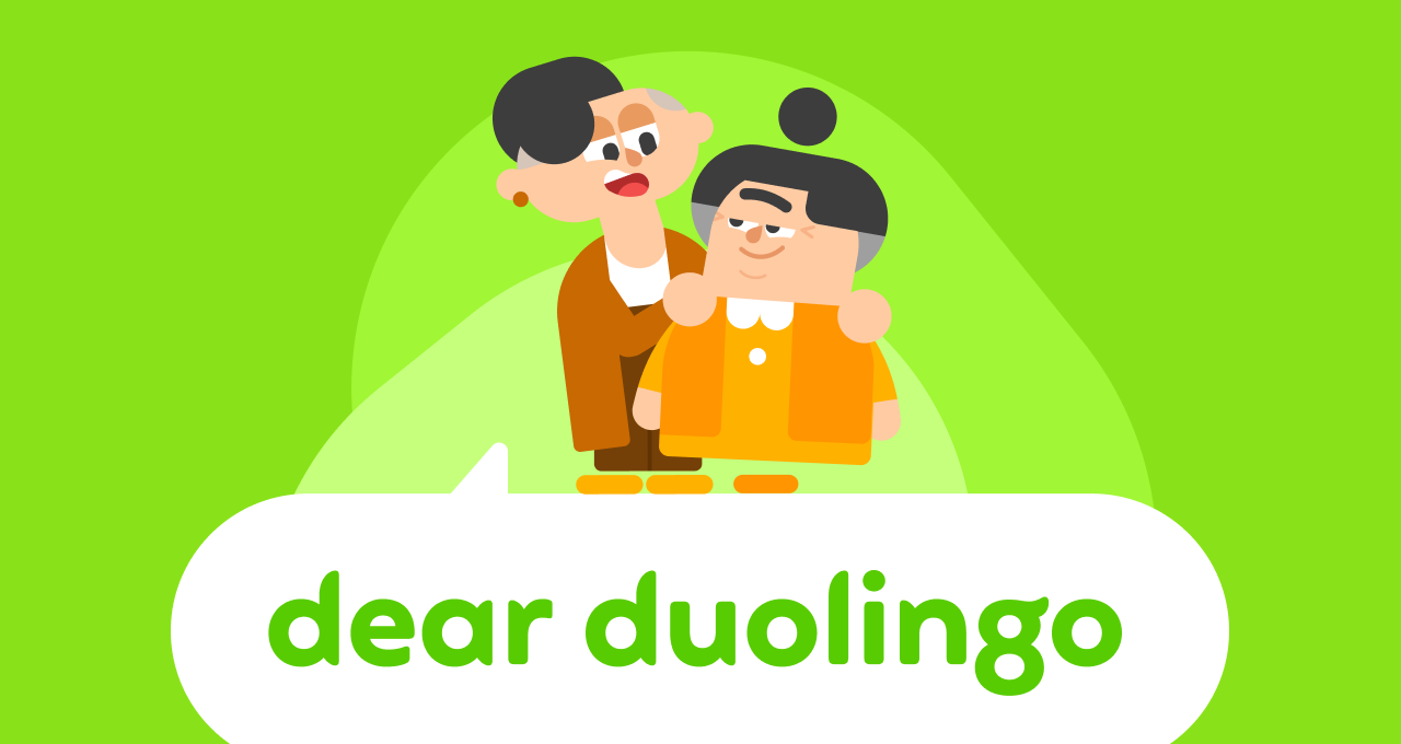 Lin and Lucy in an embrace, Lin is on the left, holding Lucy's shoulders. A speech bubble below the pair says Dear Duolingo
