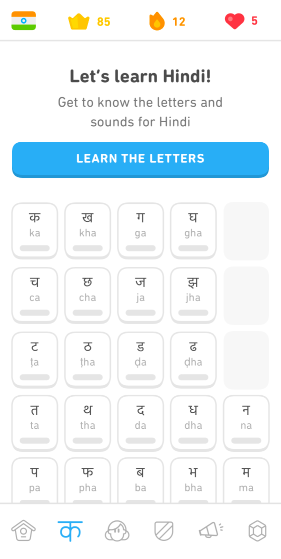 Screenshot of the Hindi course reading tab. The text at the top says "Let's learn Hindi! Get to know the characters and sounds for Hindi." Below the text is a blue button that reads "Learn the characters" and below that a chart of white tiles for the different Hindi characters. Each tile has the Hindi character, and below it the English letter or letters representing the sound.
