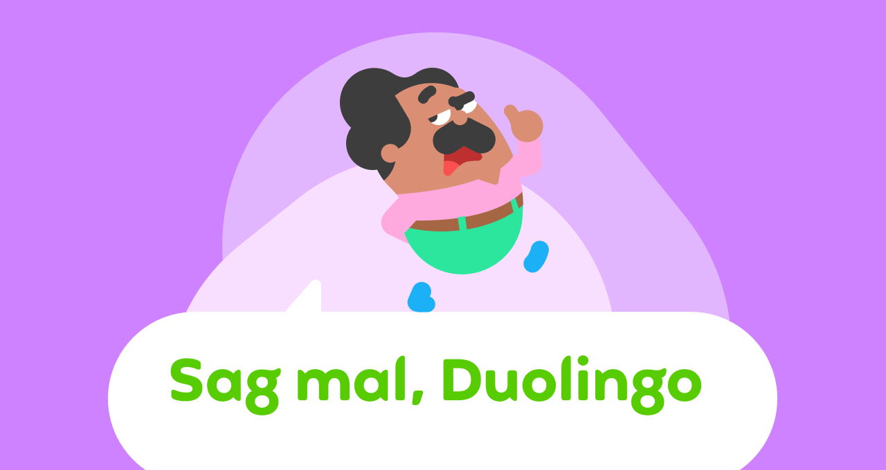 Duolingo-Charakter Oskar in Bewegung mit einem erhobenen Finger – er sieht aus, als würde er jemanden Anweisungen geben. Er befindet sich über einer Sprechblase mit der Aufschrift „Sag mal, Duolingo“