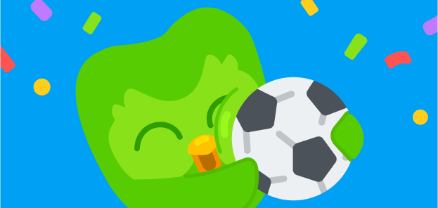 Illustration of the Duolingo owl hugging a soccer ball, surrounded by confetti