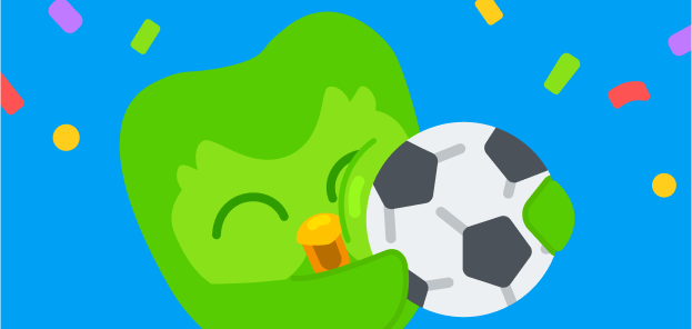 Illustration de Duo le hibou serrant un ballon de football dans les bras avec des confettis qui volent autour de lui