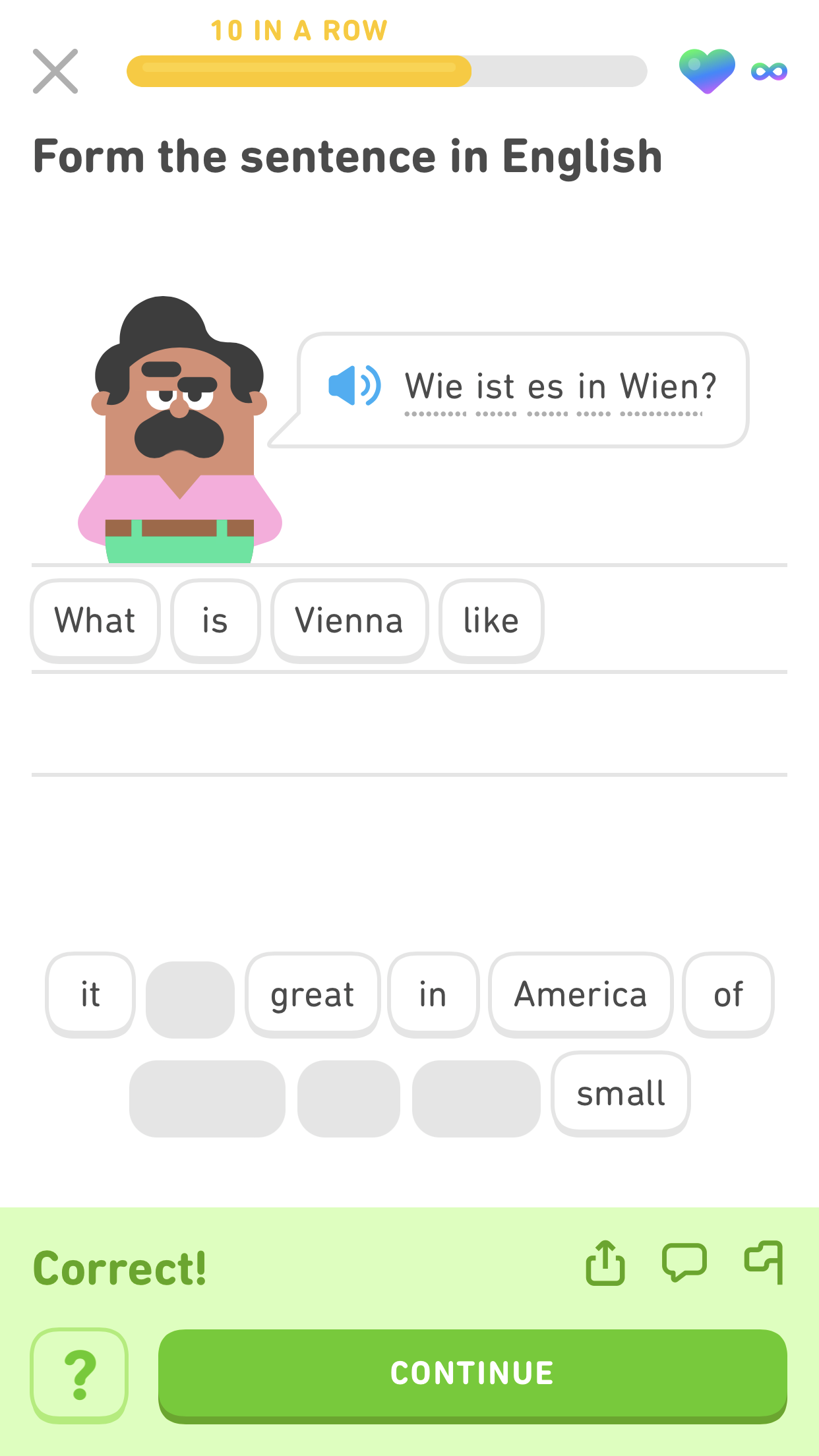 screenshot of an exercise for the German sentence 'Wie ist es in Wien?' The English tiles below say 'What is Vienna like?' and the bottom of the screen is green with the message 'Correct!'