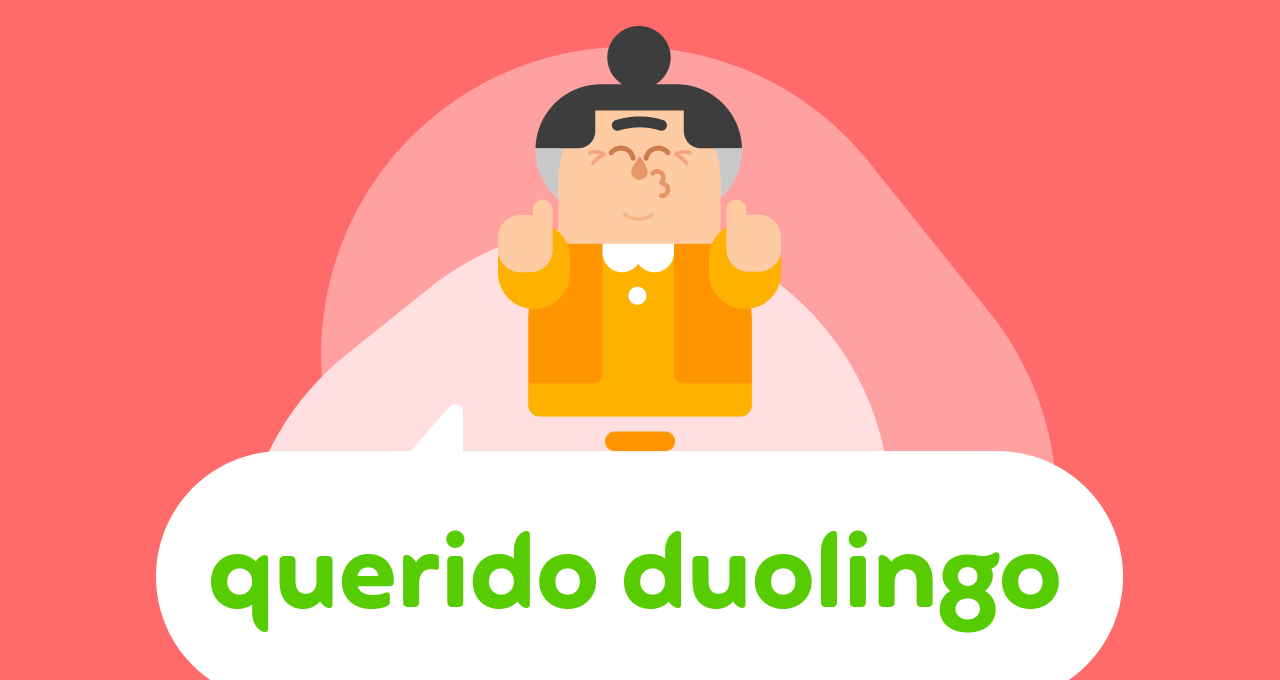 A personagem Lucy, do Duolingo, sorri e faz o gesto de polegar para cima com as mãos. Abaixo dela se lê “Querido Duolingo” em um balão de diálogo.