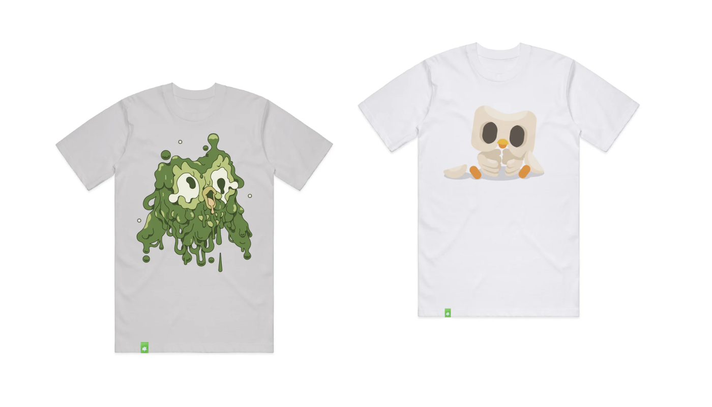 Two white t-shirts. The first has a design of Duo the owl melting and looking shocked. His skin is like candle wax, melting down the shirt. The second is an image of Duo’s skeleton.