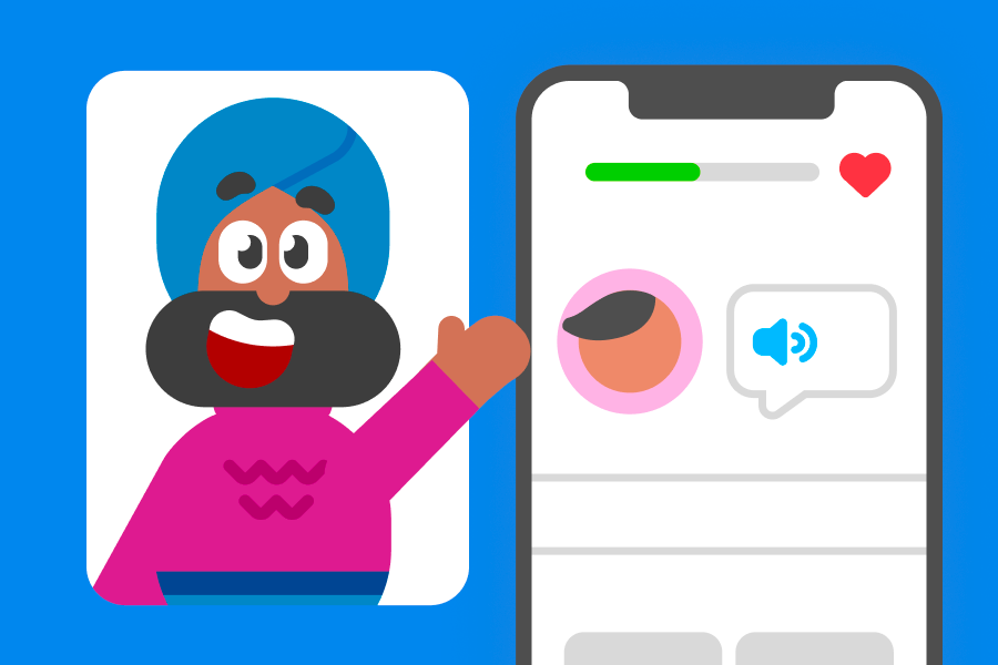 Imagen de Vikram saludando al lector, junto a un teléfono que muestra una lección de Duolingo