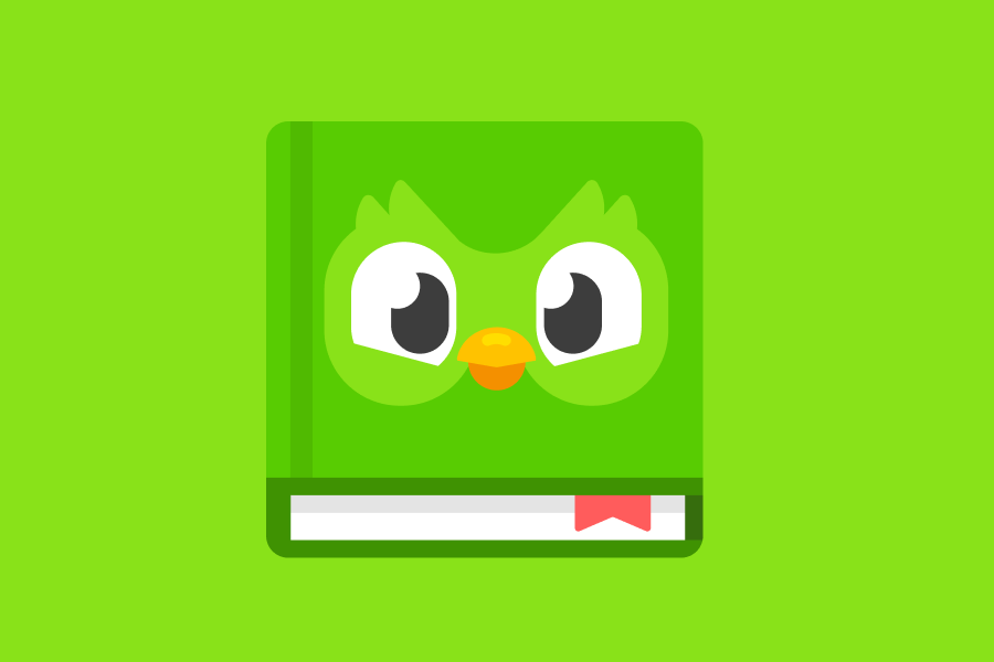 Un gran libro verde con la cara de Duo en la tapa y un marcador rojo entre sus páginas.