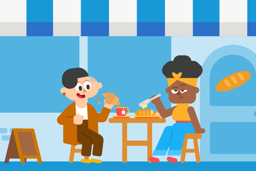 Duolingo characters Lin and Bea sit in front of a bakery with a blue and white awning, eating a croissant and a baguette with butter.