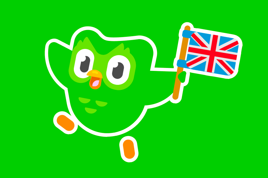 Duo the owl holding the British flag and looking cheerful